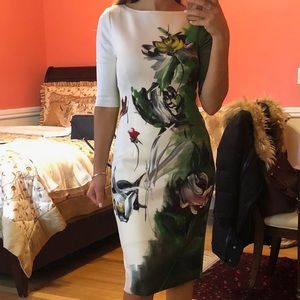 Dress white and green with flowers size 2, taken in fits more of a 0